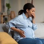 woman suffering from morning sickness in Howard County