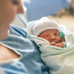woman after a low-intervention birth in Howard County
