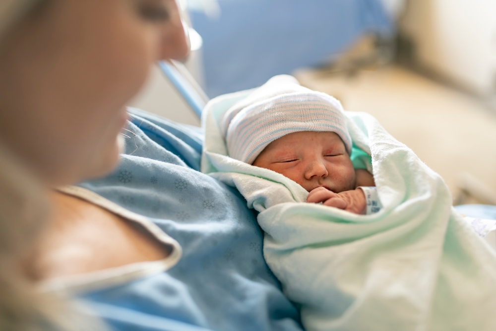 woman after a low-intervention birth in Howard County