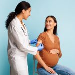 pregnant woman receiving vaccines in Howard County