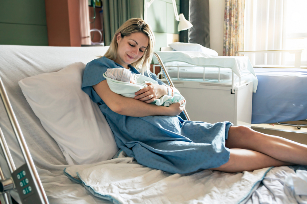 woman with baby after her VBAC in Howard County