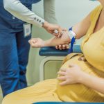 woman retaking blood after a positive NIPT results in Howard County