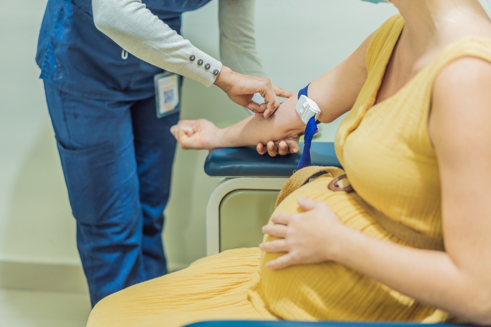 woman retaking blood after a positive NIPT results in Howard County