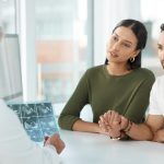 couple talking to doctor about each trimester ultrasound and what to expect